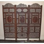 A THREEFOLD INDIAN CARVED OPENWORK SCREEN, late 19th or early 20th century,