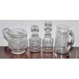 TWO SMALL CUT GLASS DECANTERS AND STOPPERS, one as is; a 19th century cut glass water jug,