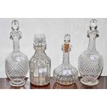 A PAIR OF LATE VICTORIAN CUTGLASS BOTTLE SHAPED WINE DECANTERS, each with prism stopper,