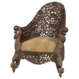 A VERY ORNATE CARVED AND PIERCED VICTORIAN BURMESE ARMCHAIR,