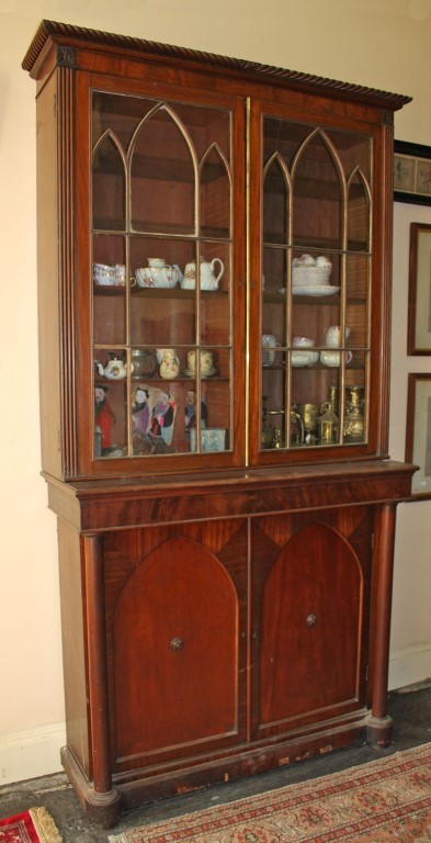 A 19TH CENTURY MAHOGANY BOOKCASE, in the Gothic style, the top George IV period,