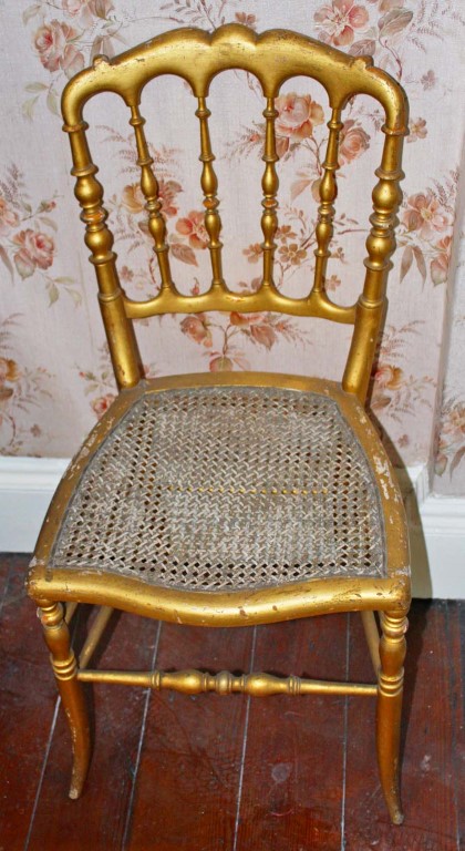 A SET OF FOUR 19TH CENTURY GILT BALLROOM CHAIRS, each with turned rail back and cane seat,
