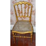 A SET OF FOUR 19TH CENTURY GILT BALLROOM CHAIRS, each with turned rail back and cane seat,