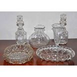A PAIR OF CUT GLASS DECANTERS, each of reeded mallet form, with matching stoppers,