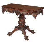 AN IRISH EXHIBITION YEW WOOD CARVED FOLDOVER TEA-TABLE,