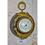 A FRENCH BRONZE AND GILT BRONZE SEDAN CHAIR ANEROID BAROMETER, with circular enamel dial,