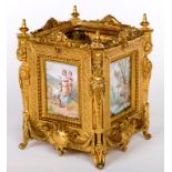 A FINE SQUARE ORMOLU JARDINIERE, late 19th century, with four hand painted enamel panels,