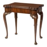 A GEORGE II PERIOD MAHOGANY FOLD OVER CARD TABLE, with projecting rounded corners,