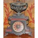 A POLISHED LIMESTONE AND ROUGE MARBLE MANTEL CLOCK, the rouge and black marble dial signed J.F.