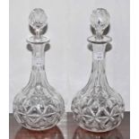 A GOOD HEAVY PAIR OF LATE 19TH CENTURY CUT GLASS DECANTERS AND STOPPERS, each of bottle form,