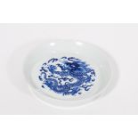 A FINE QUALITY SMALL CHINESE BLUE AND WHITE DISH, the centre decorated with a five claw dragon,