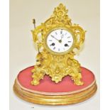 A SMALL FRENCH ROCOCO STYLE BOUDOIR MANTEL CLOCK, the lever movement striking on a brass bell,