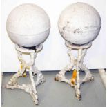 A PAIR OF HEAVY CAST IRON PILLAR ORNAMENTS OR FINIALS, each with a spherical top,