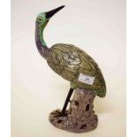 A CHINESE PORCELAIN FIGURE OF A STORK, standing with head turned back,