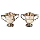 A GOOD PAIR OF IRISH EARLY GEORGE III SILVER CRESTED TWO HANDLED CUPS,