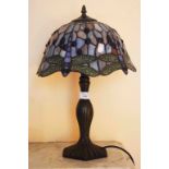 A TIFFANY STYLE MUSHROOM TABLE LAMP, with bronzed stem and coloured glass shade, 18" (46cm)h.