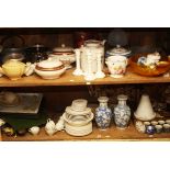 TWO SHELVES OF MISCELLANEOUS KITCHEN WARE, comprising candlesticks, teapots, vegetable tureens,