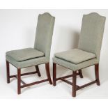 A SET OF TEN MAHOGANY DINING CHAIRS, each with a padded hump back and padded seat,