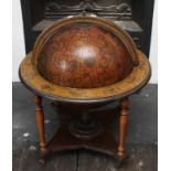 A MODERN COCKTAIL STAND, in the form of a terrestrial globe, with hinged top,