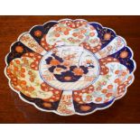 A LARGE JAPANESE IMARI WALL PLAQUE, decorated in typical pallete with basket of flowers,