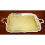 A HEAVY SILVER PLATED SERVING TRAY, late 19th century, with gadroon and cast edge,