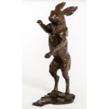 A BRONZE STUDY OF A STANDING HARE, with chocolate patina, on shaped stand, 22.25" (57cm).