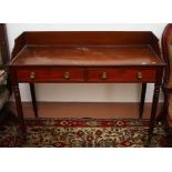 A GEORGE IV PERIOD MAHOGANY DRESSING TABLE, the three quarter gallery,