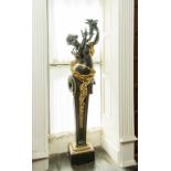 AFTER GARNIER a bronzed cast iron and parcel gilt caryatid, semi nude holding a cornucopia,