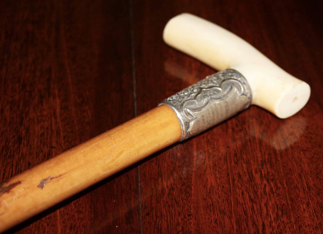 A GOOD MALACCA PRESENTATION HAND STICK, with ivory handle and silver collar, presented to Mr. W.