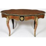 A 19TH CENTURY EBONISED AND RED BOULLE CENTRE TABLE, with ornate brass mounts,