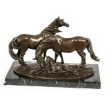 A BRONZE EQUESTRIAN GROUP, modelled with two horses and a foal,