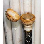 AN EBONY BONE AND FAUX IVORY NOVELTY WALKING CANE,