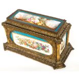 A FINE FRENCH GILT BRONZE AND PORCELAIN JEWELLERY CASKET, of sarcophagus form,