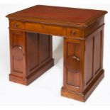 AN EDWARDIAN MAHOGANY PEDESTAL ARCHITECTS DESK, the lift up top with an adjustable ratchet,