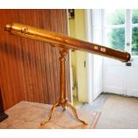 A 19TH CENTURY BRASS THREE STAGE TABLE TELESCOPE, on heavy brass folding tri-pod base,