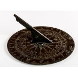 A CIRCULAR BRONZE SUNDIAL, with engraved bands, with the months of the year,