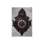 A VERY ATTRACTIVE LATE 19TH CENTURY CARVED OAK BLACK FOREST WALL CLOCK, with two train movement,
