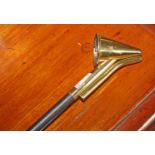 A BRASS CANDLE SNUFFER, with long ebonized handle, 38.5" (98cm).