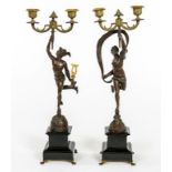 AN UNUSUAL PAIR OF BRONZE AND BRASS CANDELABRA, after Gianbologna, modelled as Mercury and Eros,