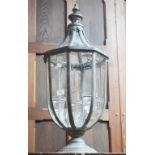 A BRONZED METAL CANDLE LANTERN, of octagonal baluster form,