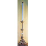 A PAIR OF TALL GOTHIC STYLE BRASS ALTAR CANDLESTICKS, each on tri-pod base, 36" (92cm).