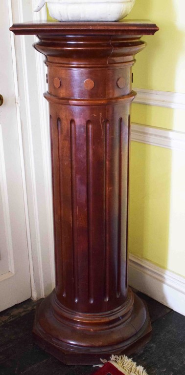 A MAHOGANY PEDESTAL WITH SQUARE SWIVEL TOP, raised on a turned and fluted cylindrical stem,