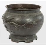 A LARGE JAPANESE BRONZE JARDINIERE, with birds and tree branches in relief,