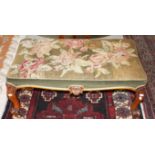 A RECTANGULAR VICTORIAN WALNUT STOOL, with tapestry seat, raised on moulded cabriole legs,