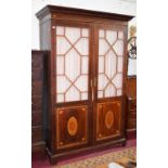 A 19TH CENTURY INLAID MAHOGANY WARDROBE, the dentil moulded cornice, above an inlaid frieze,