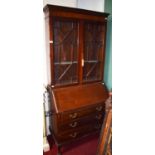 A MAHOGANY SLOPE FRONT BUREAU BOOKCASE