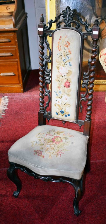 A VICTORIAN ROSEWOOD PRIE DIEU, the high back with a tapestry panel,