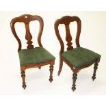 A SET OF SIX LATE VICTORIAN MAHOGANY DINING CHAIRS, each with a shaped back and centre splat,