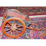 A WOODEN SCALE MODEL OF A HORSES CART, with two shafts, and wooden spoked wheels with iron rims,