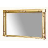 A LARGE 19TH CENTURY GILT OVERMANTEL, the rectangular frame with leaf moulded half round pilasters,